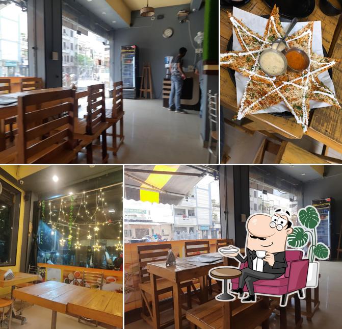 Take a seat at one of the tables at Dosa capital