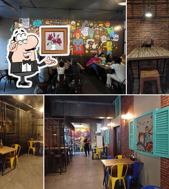 Take a seat at one of the tables at Urban Paratha Vyttila