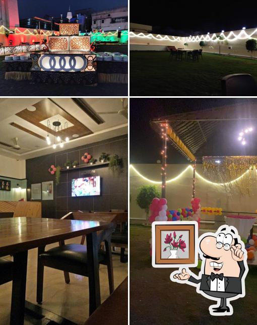 Take a seat at one of the tables at Hotel R R Lodging, Restaurant & Lawn