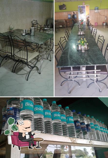 Take a look at the photo depicting interior and beverage at Hotel Saptagiri