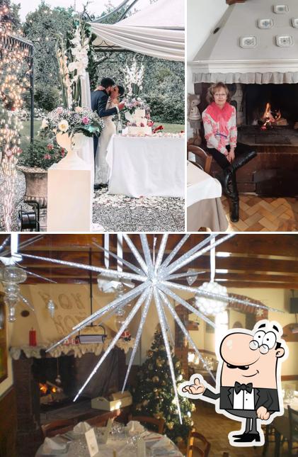 Guarda la immagine che mostra la interni e tavolo da pranzo di Ristorante Casa Bianca