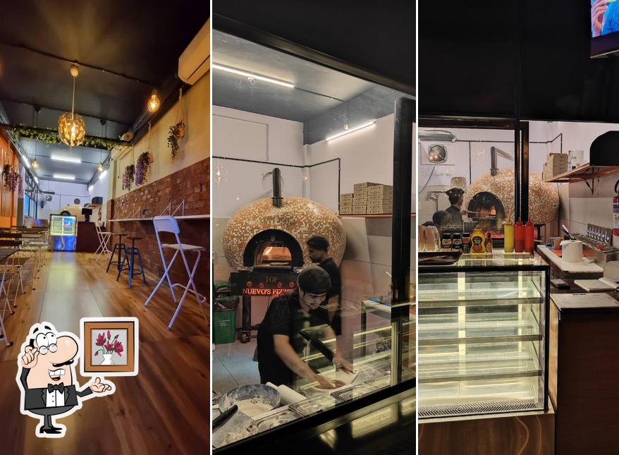 Take a seat at one of the tables at Nuevo's Pizzeria