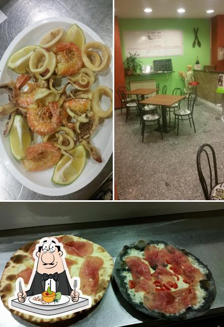 La foto di cibo e tavolo da pranzo da Pizzeria Da Franco La foto di cibo e tavolo da pranzo da Pizzeria Da Franco
