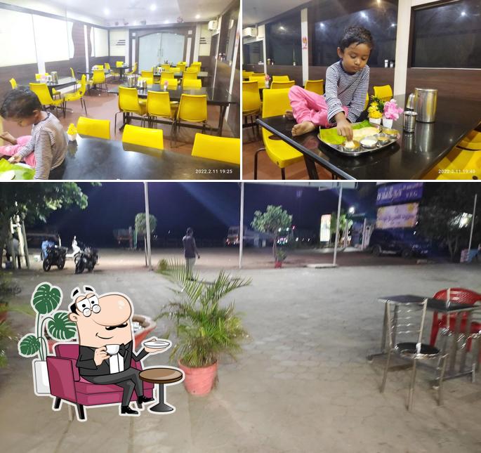 Take a seat at one of the tables at Raja Restaurant