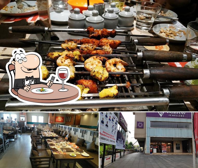 This is the picture displaying food and exterior at Barbeque Nation