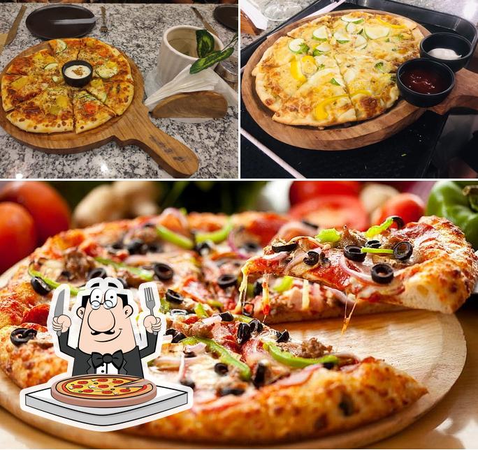 Order pizza at Amigos Café and Restaurant