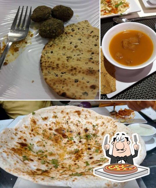 Get pizza at Saffron Restaurant