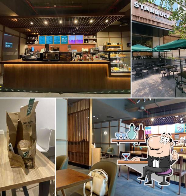 Take a seat at one of the tables at Starbucks Coffee Marol