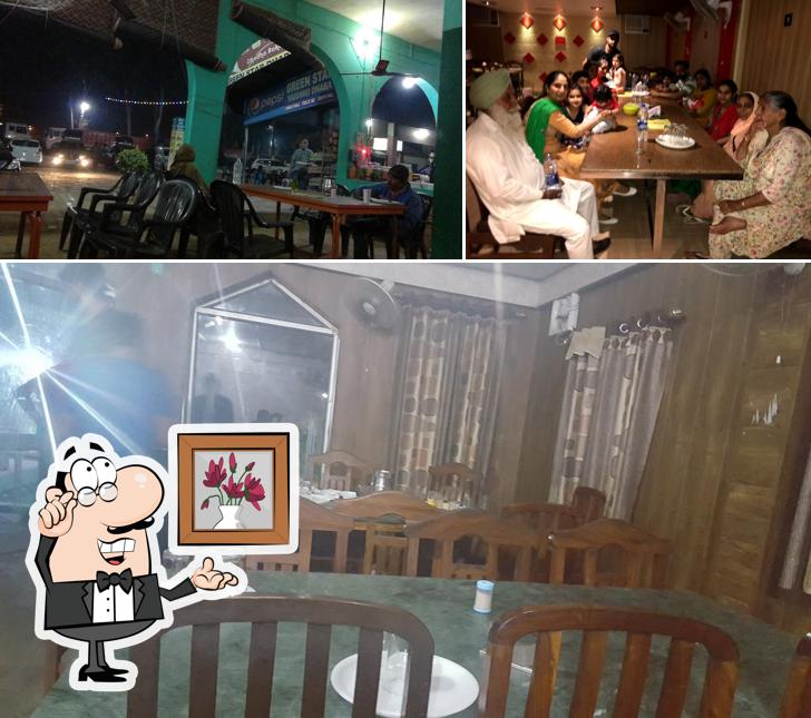 The photo of Green Star Vaishno Dhaba’s interior and dining table