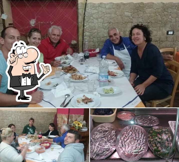 Questa è la foto che mostra la interni e cibo di Trattoria Il Pescatore