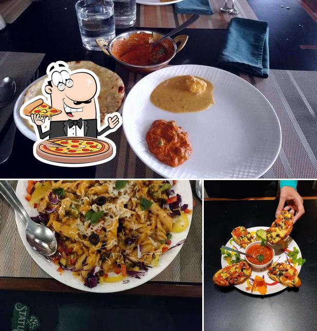 Get pizza at Status Restaurant & Banquet