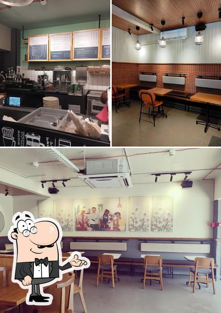 Take a seat at one of the tables at Third Wave Coffee