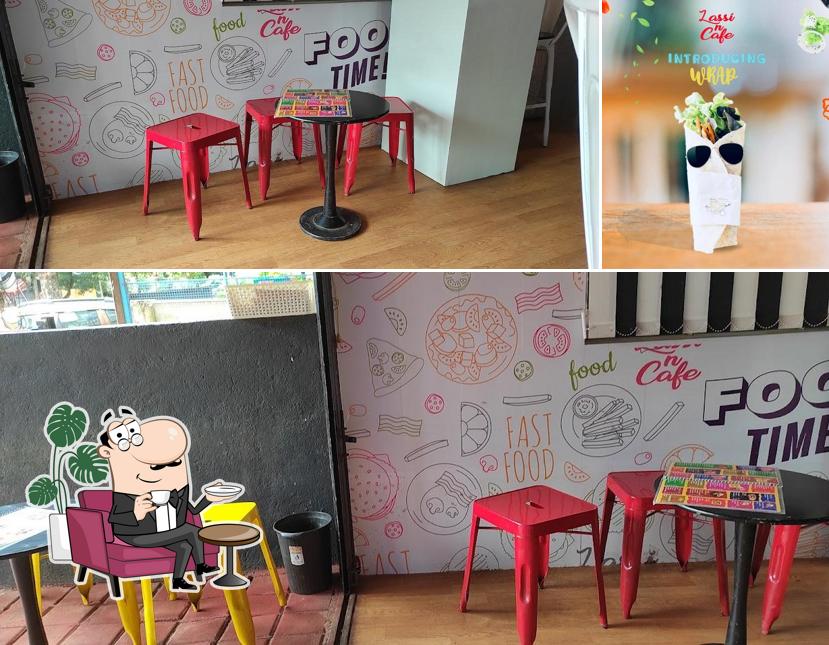 Take a seat at one of the tables at Lassi n Cafe (International) Dharwad