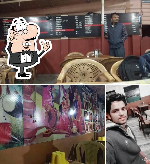 Take a seat at one of the tables at Gurunanak Punjabi Dhaba Veg And Non Veg