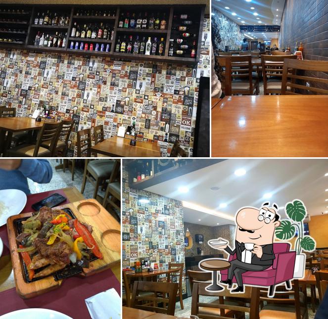 Sente em uma das mesas no Estrela Grill