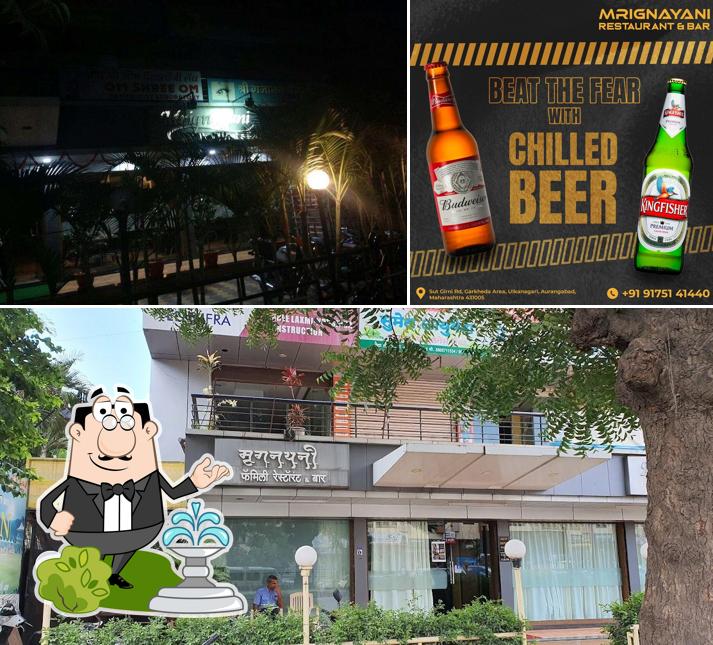Take a look at the image showing exterior and beverage at Mrignayani Restaurant and Bar