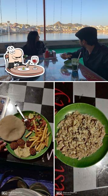 Check out the image displaying food and dining table at Doctor Alone Hostel & Cafe