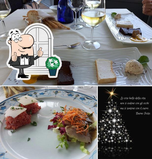 Puoi goderti l'aria fresca da seduto all'esterno di Ristorante La Rosa Dei Vini