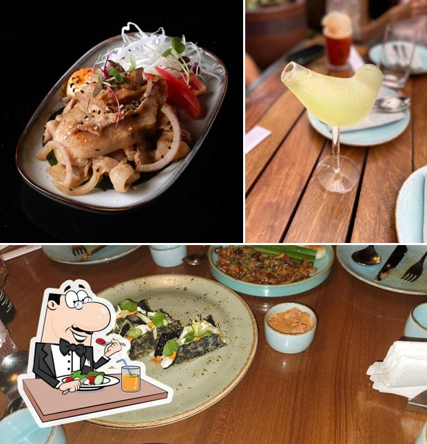 Take a look at the photo showing food and interior at Soy Como Soy