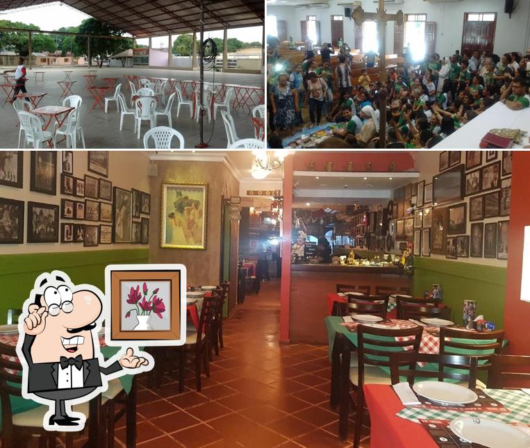 Sente em uma das mesas no Bizzum da Pizza