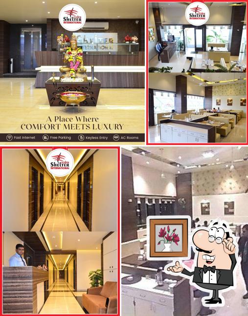 Take a seat at one of the tables at Rudra Shelter International Hotel