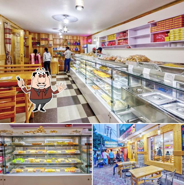 Among different things one can find food and interior at Ayushman Sweets and Bakers - pure Veg Restaurant in Manali
