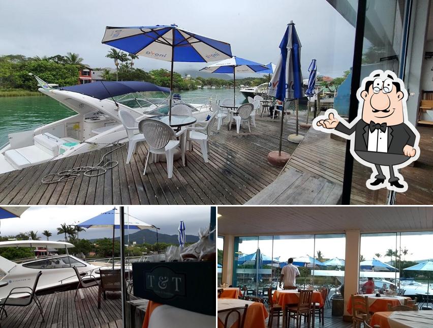 Sente em uma das mesas no Fedoca do Canal Restaurante de Frutos do Mar e Pizzas