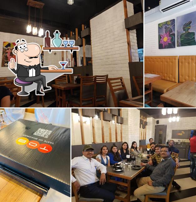 Take a seat at one of the tables at Simply South By Taste Of Bhagwati