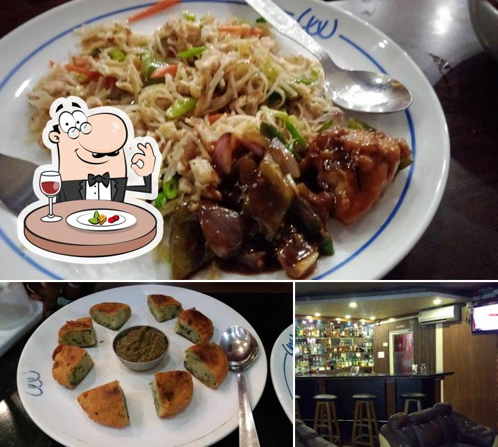 Among various things one can find food and bar counter at Outram Club