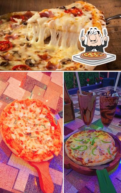 Try out pizza at Sheikh Cafe & Lounge Restaurant