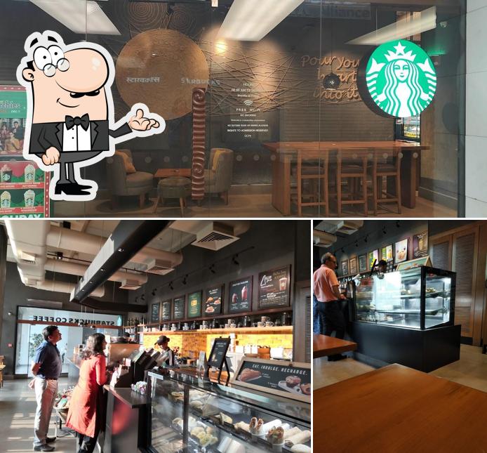 Take a seat at one of the tables at Starbucks