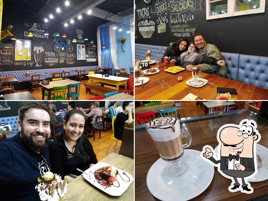 Sente em uma das mesas no Doces Momentos Restaurante