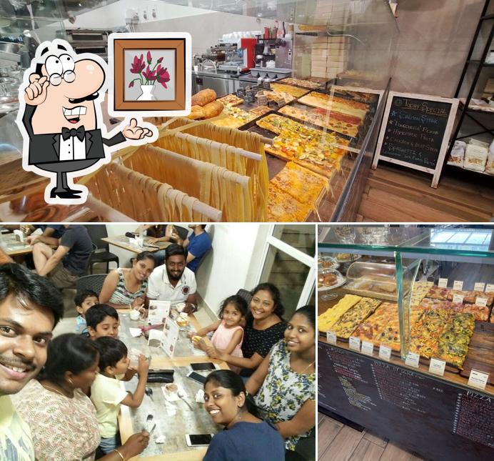 Take a seat at one of the tables at Milano Pizza