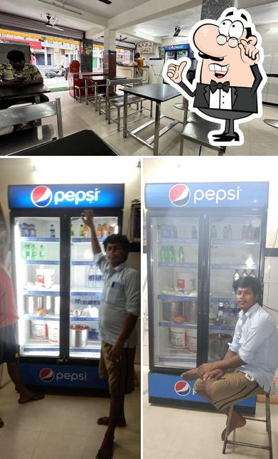 Take a seat at one of the tables at Mahaveera Tiffins And Meals