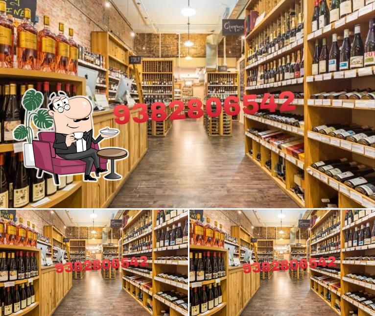 Take a seat at one of the tables at Tasmac-Adaikkalam wine shop