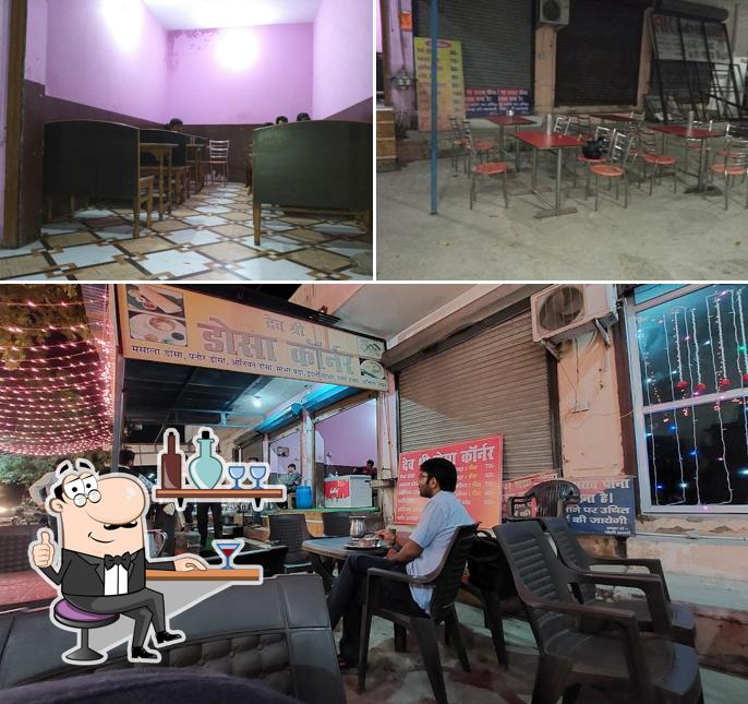 Take a seat at one of the tables at Dev Shri Dosa Corner