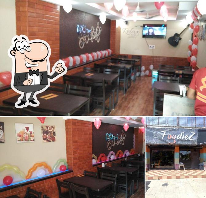 Take a seat at one of the tables at FoodieZ