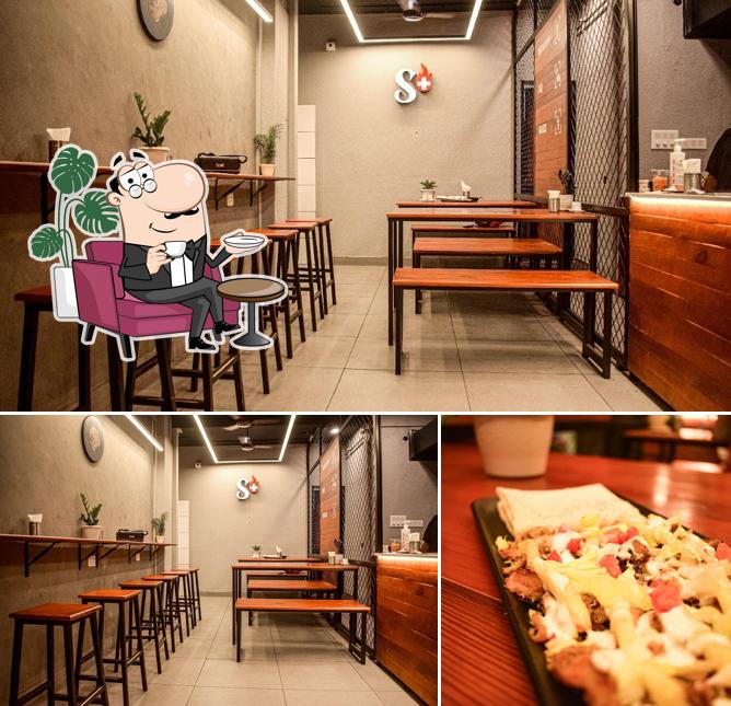 This is the image depicting interior and food at Shawarma Plus