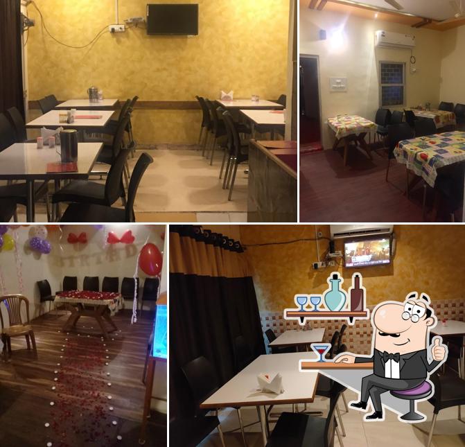 Take a seat at one of the tables at Nagpur Biryani Center