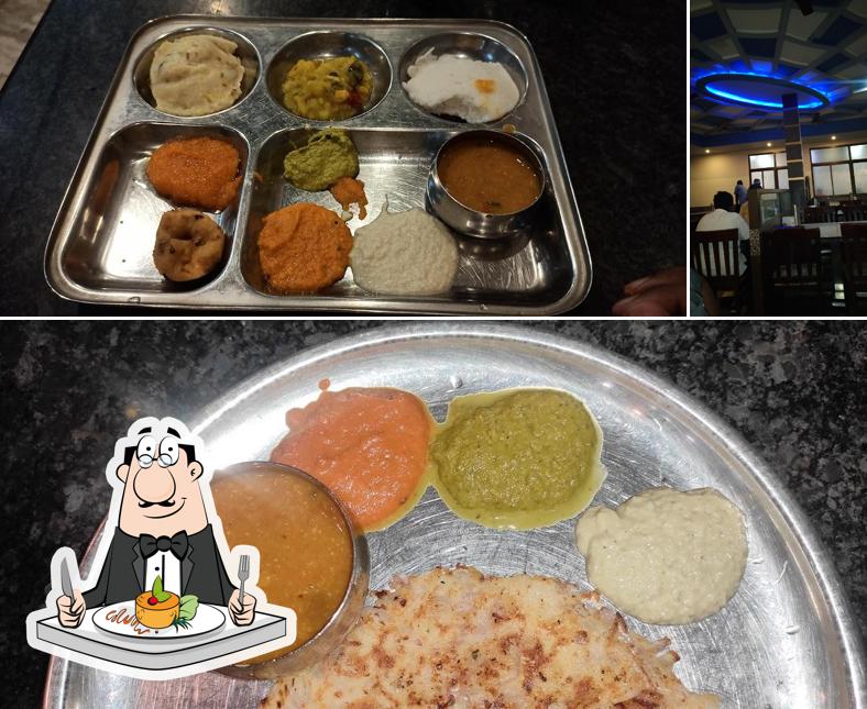 Check out the image showing food and dining table at Gowri Parvathi Bhavan Veg