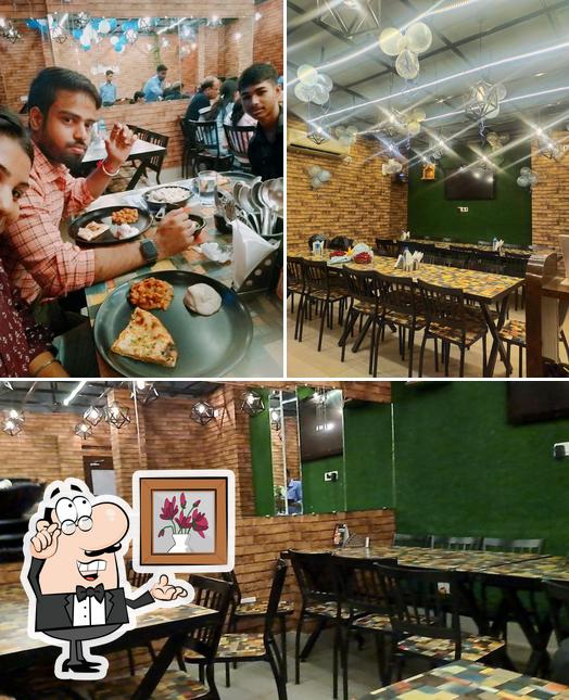 Take a look at the image depicting interior and dining table at THE KKULCHA HHOUSE