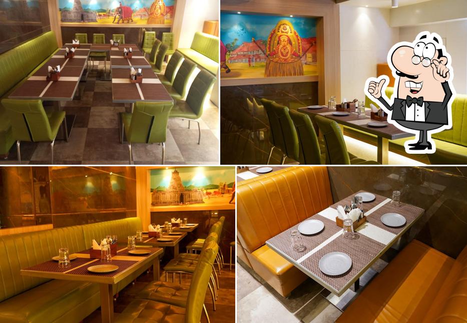 Take a seat at one of the tables at Balaji Fine Dine