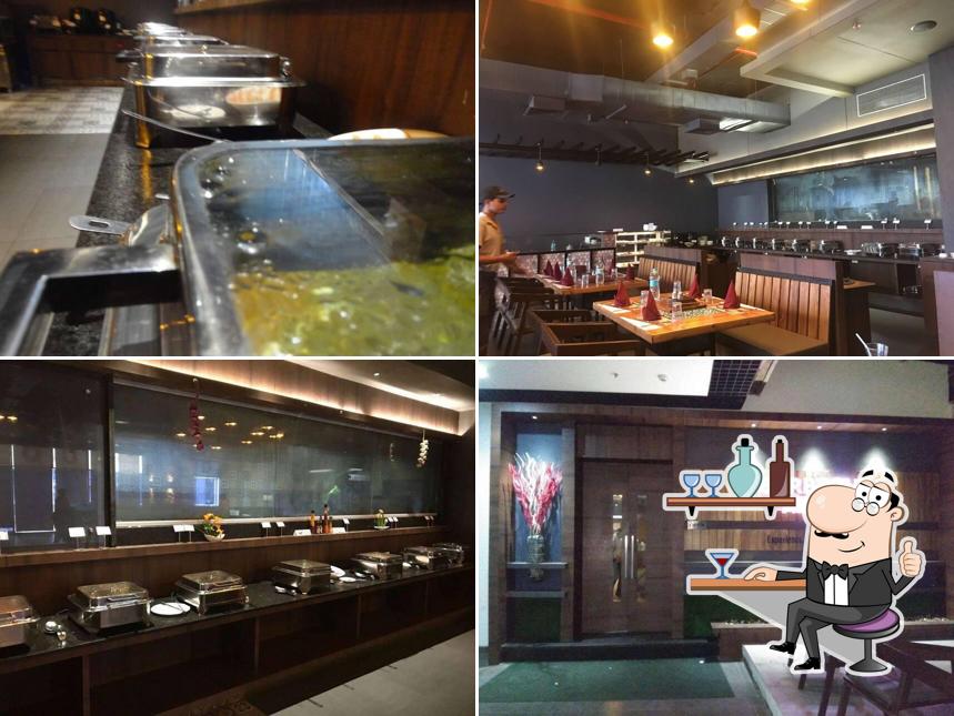 Take a seat at one of the tables at Barbeque Adda