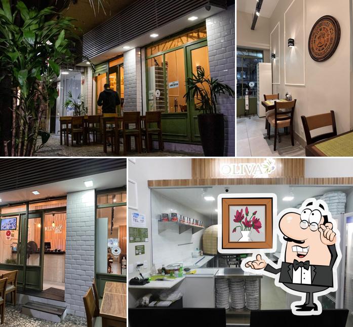 Sente em uma das mesas no Oliva D'oro Pizzaria Delivery