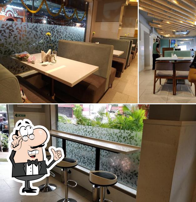 Take a seat at one of the tables at Tulsi Cafe