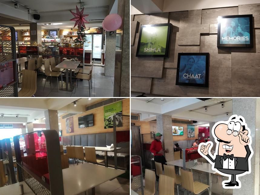 Take a seat at one of the tables at Diamond Best Bakery Sweets, Restaurant & Groceries