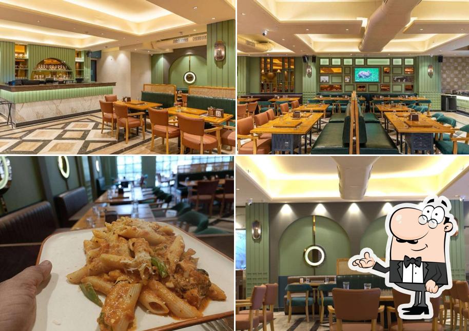 Take a seat at one of the tables at Sandoz BBQ - Janakpuri