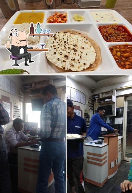 Check out the photo showing interior and food at Anand Restaurant