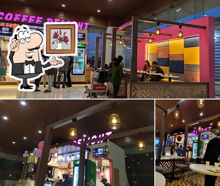 Take a look at the photo showing interior and beverage at Coffee Delight CIAL Terminal 3
