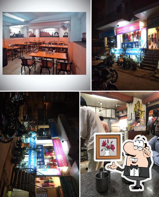 Take a seat at one of the tables at Hotel Haripriya